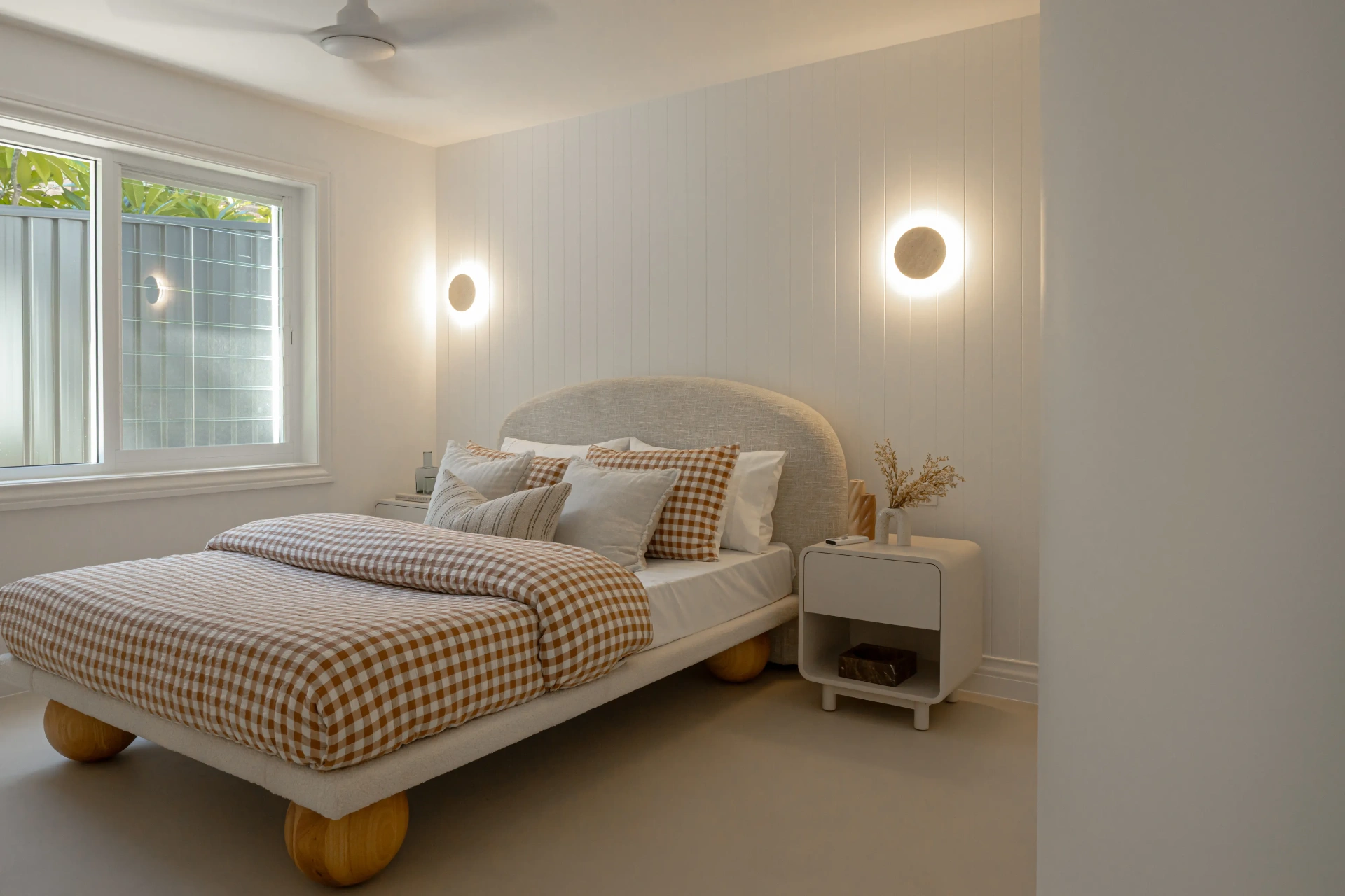 Bedroom with custom wall sconce installation